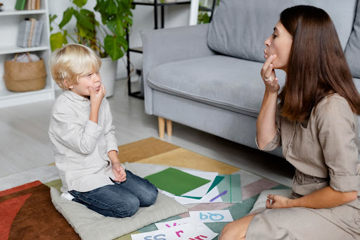 young child doing speech therapy kneib dentistry what is a frenectomy